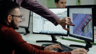 Two professionals working on BIM software, Autodesk BIM